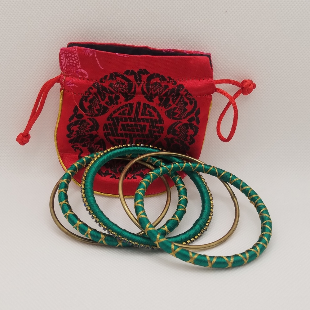 Green and gold silk thread bangles with red pouch